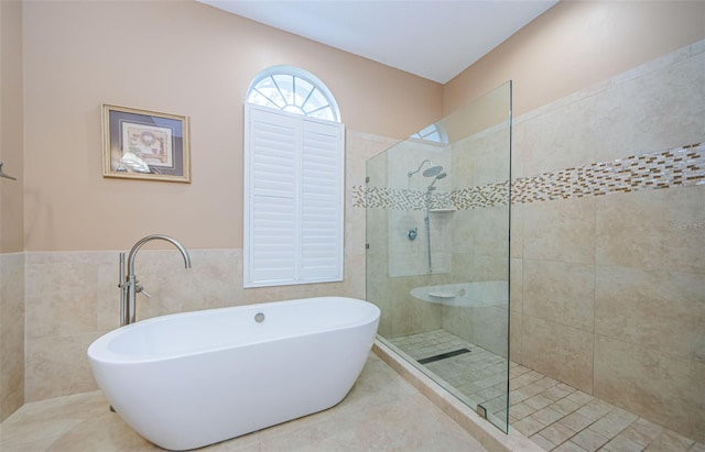 2042 Diamond Ct, Oldsmar, FL 34677 - full bathroom with a freestanding bath, a walk in shower, and tile walls