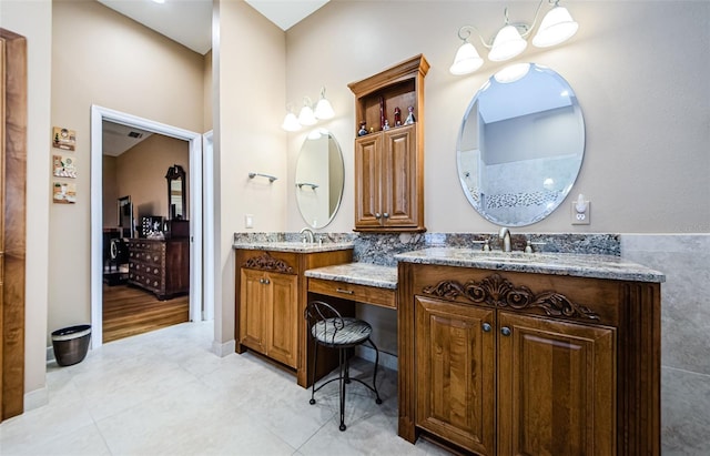 2042 Diamond Ct, Oldsmar, FL 34677 - full bathroom featuring two vanities, tile patterned floors, and a sink