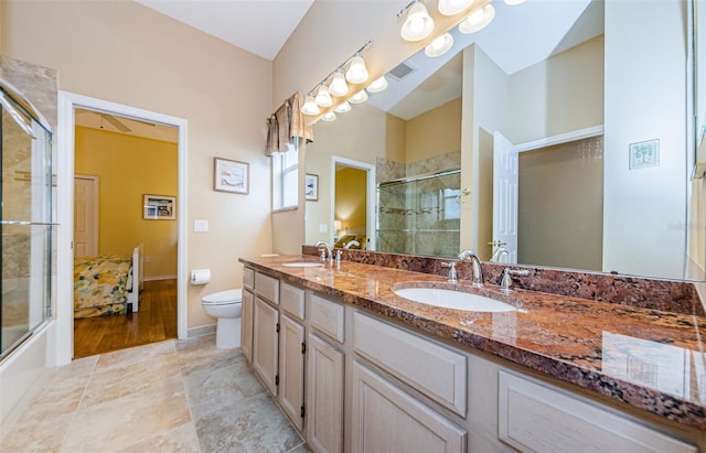 2042 Diamond Ct, Oldsmar, FL 34677 - bathroom featuring double vanity, a sink, and a shower with door