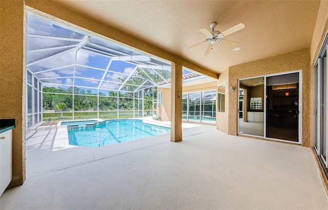 2042 Diamond Ct, Oldsmar, FL 34677 - view of swimming pool with a pool with connected hot tub, a patio area, glass enclosure, and ceiling fan