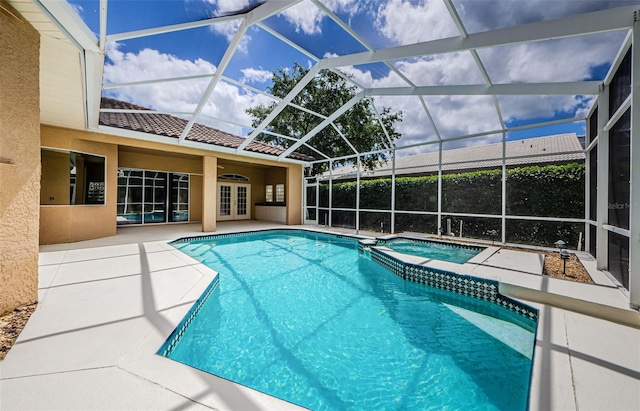 2042 Diamond Ct, Oldsmar, FL 34677 - view of pool featuring glass enclosure, french doors, a patio area, and a pool with connected hot tub