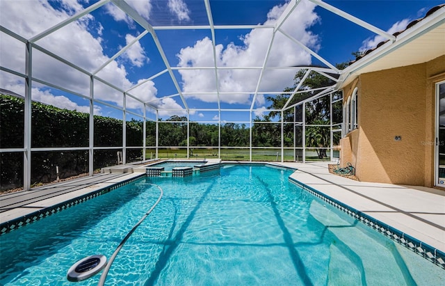 2042 Diamond Ct, Oldsmar, FL 34677 - view of pool with glass enclosure, a pool with connected hot tub, and a patio