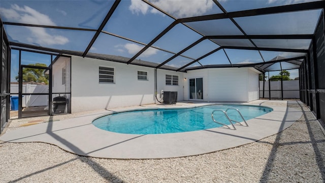 view of swimming pool with a fenced in pool, a lanai, and a patio area