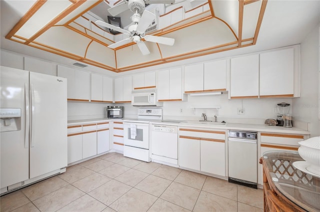 kitchen with white cabinets, a sink, visible vents, white appliances, and light countertops