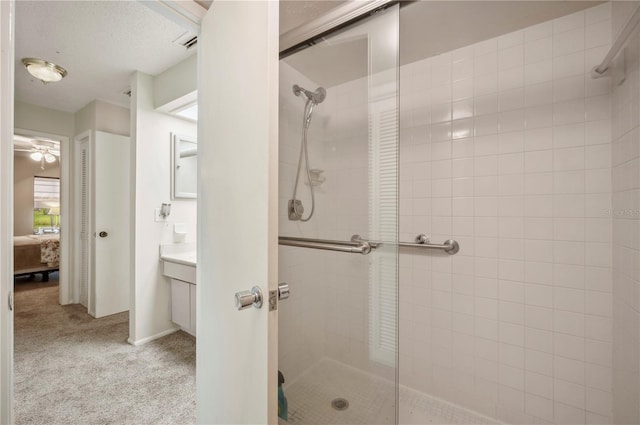 bathroom with a shower stall, ensuite bath, vanity, and visible vents
