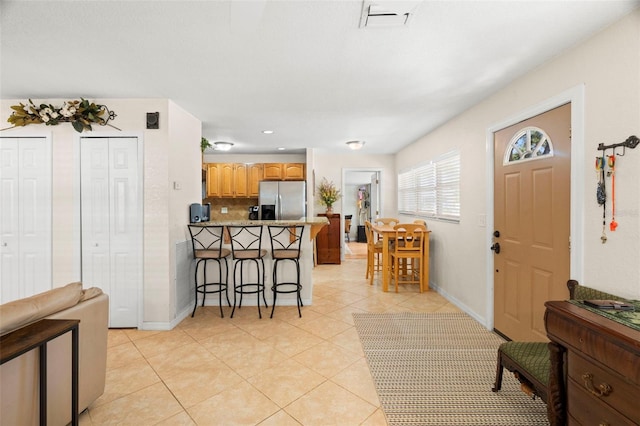 2903 W Paxton Ave, Tampa, FL 33611 - foyer entrance with baseboards, light tile patterned floors, and recessed lighting
