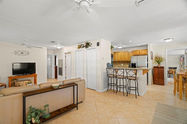 2903 W Paxton Ave, Tampa, FL 33611 - living area featuring ceiling fan, light tile patterned flooring, baseboards, and recessed lighting