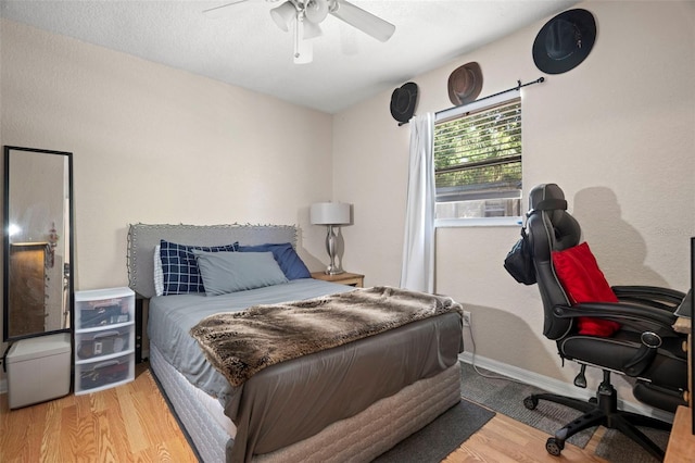 2903 W Paxton Ave, Tampa, FL 33611 - bedroom featuring a desk, wood finished floors, and ceiling fan