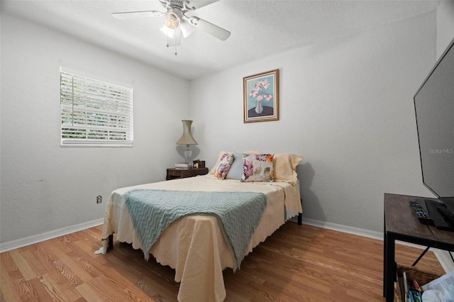 2903 W Paxton Ave, Tampa, FL 33611 - bedroom featuring wood finished floors, baseboards, and a ceiling fan