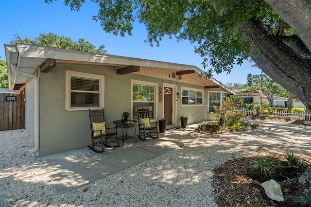 2903 W Paxton Ave, Tampa, FL 33611 - rear view of property with stucco siding and a patio