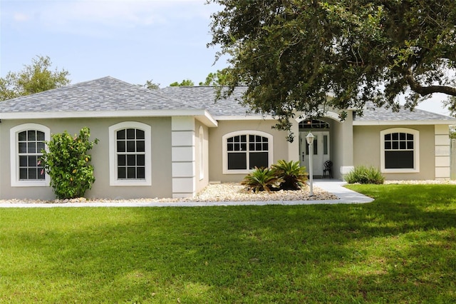 6917 Spumoni St, Sebring, FL 33872 - ranch-style home featuring a shingled roof, stucco siding, and a front yard