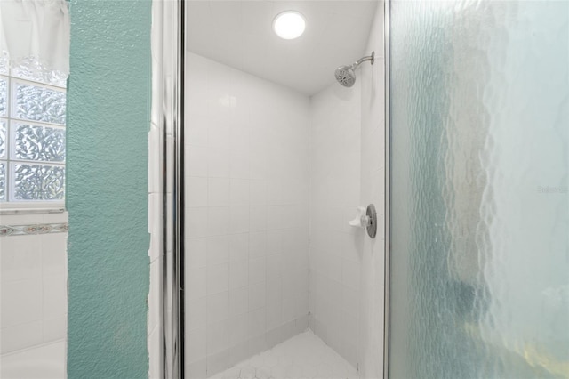 6917 Spumoni St, Sebring, FL 33872 - bathroom with a shower stall and a textured wall