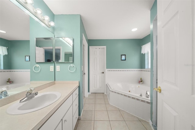 6917 Spumoni St, Sebring, FL 33872 - bathroom featuring tile patterned flooring, a tub with jets, and vanity
