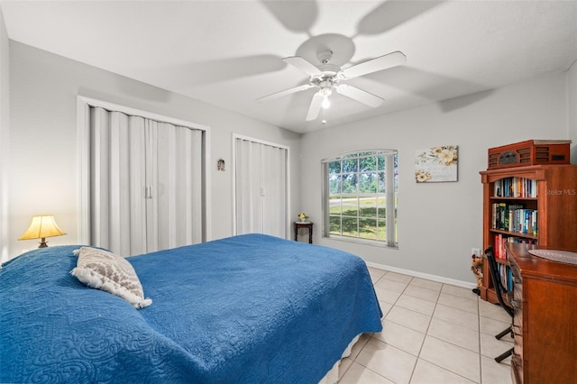 6917 Spumoni St, Sebring, FL 33872 - bedroom featuring light tile patterned floors, two closets, baseboards, and a ceiling fan