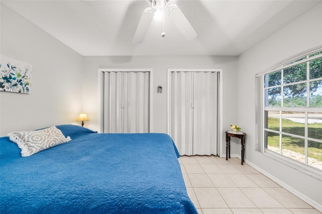 6917 Spumoni St, Sebring, FL 33872 - bedroom featuring multiple windows, light tile patterned flooring, ceiling fan, and baseboards