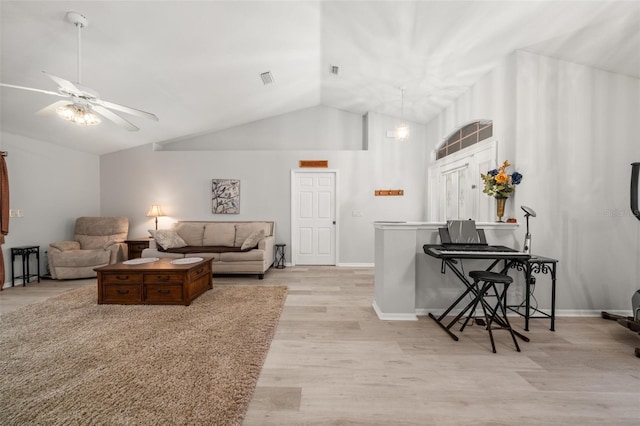 6917 Spumoni St, Sebring, FL 33872 - living area with vaulted ceiling, light wood-style flooring, ceiling fan, and baseboards