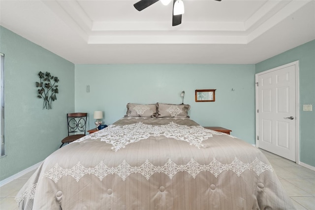 6917 Spumoni St, Sebring, FL 33872 - bedroom with a tray ceiling, light tile patterned floors, ceiling fan, and baseboards