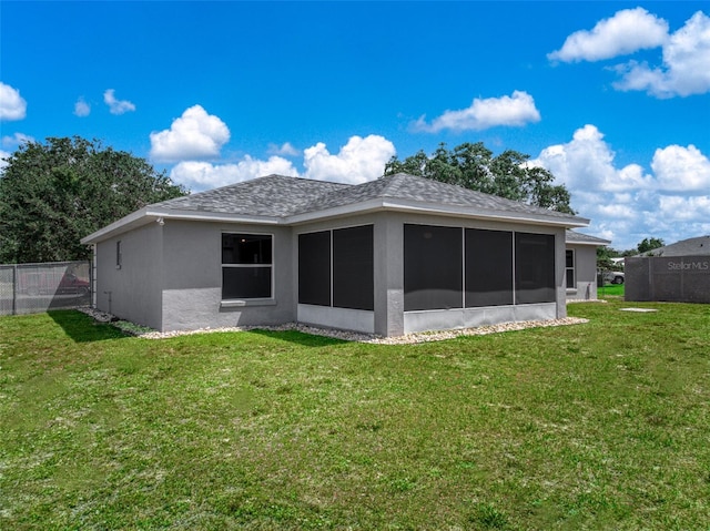 6917 Spumoni St, Sebring, FL 33872 - back of house featuring a sunroom, stucco siding, and roof with shingles