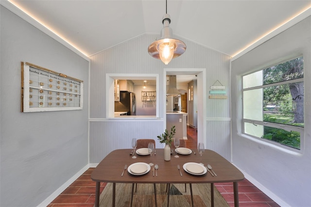10824 Palmetto St, Riverview, FL 33569 - dining area with vaulted ceiling, wood finished floors, and baseboards