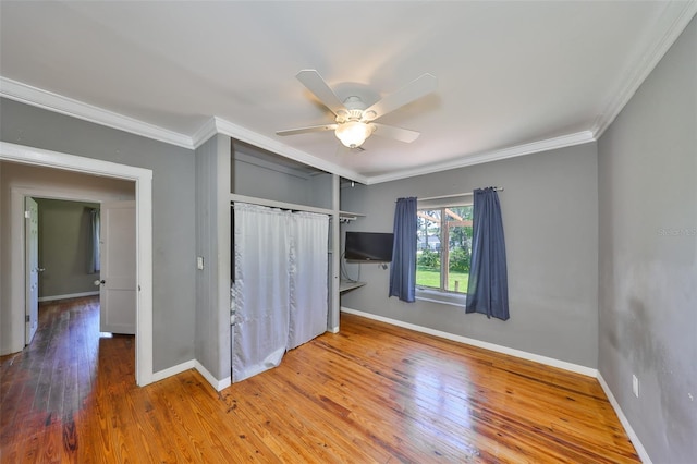 10824 Palmetto St, Riverview, FL 33569 - unfurnished bedroom with baseboards, ornamental molding, hardwood / wood-style flooring, a closet, and a ceiling fan