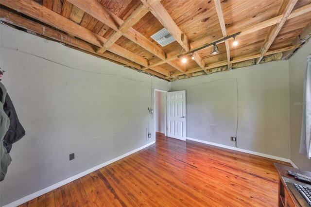 10824 Palmetto St, Riverview, FL 33569 - spare room with track lighting, wood ceiling, baseboards, and hardwood / wood-style floors