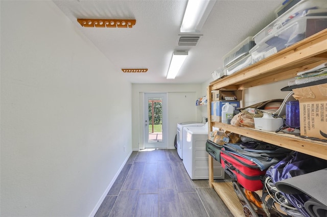 10824 Palmetto St, Riverview, FL 33569 - clothes washing area featuring independent washer and dryer, dark wood-style floors, and baseboards
