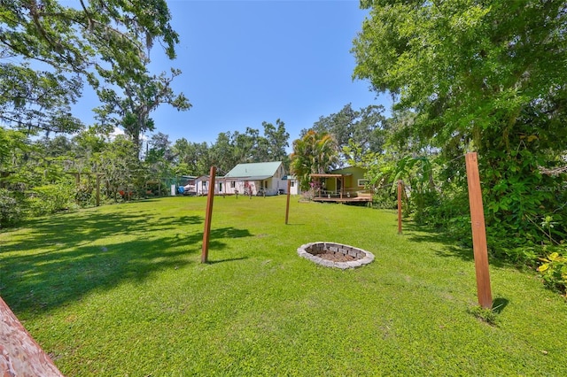 10824 Palmetto St, Riverview, FL 33569 - view of grassy yard with a deck