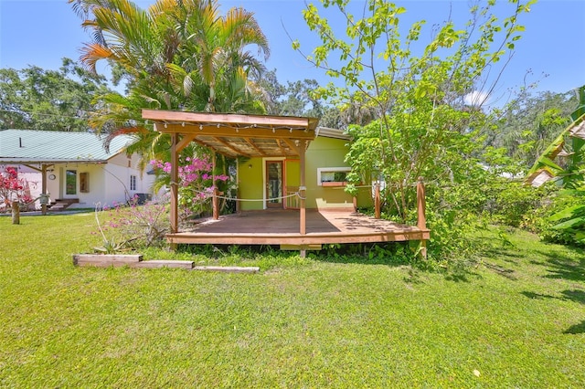 10824 Palmetto St, Riverview, FL 33569 - back of house with a wooden deck, a lawn, and stucco siding