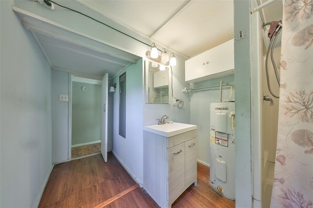 10824 Palmetto St, Riverview, FL 33569 - bathroom with electric water heater, wood finished floors, and vanity