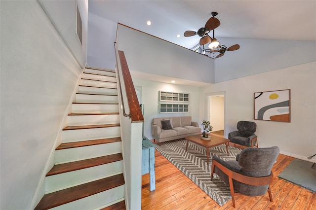 10824 Palmetto St, Riverview, FL 33569 - stairs featuring wood finished floors, ceiling fan, high vaulted ceiling, and baseboards