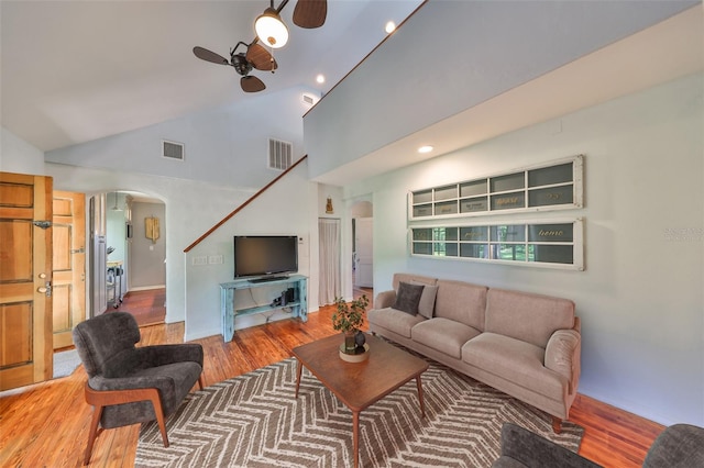 10824 Palmetto St, Riverview, FL 33569 - living room with arched walkways, a ceiling fan, wood finished floors, recessed lighting, and high vaulted ceiling