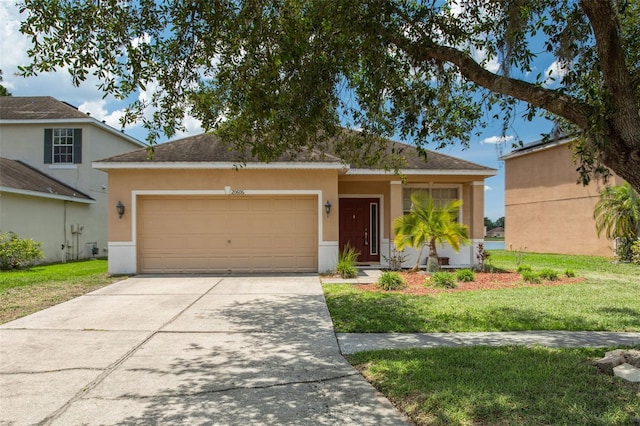 20606 Whitewood Way, Tampa, FL 33647 - view of front of property with a garage, stucco siding, driveway, and a front lawn