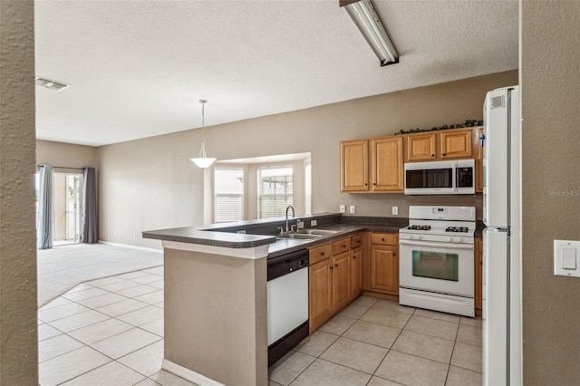 20606 Whitewood Way, Tampa, FL 33647 - kitchen with white appliances, dark countertops, a sink, light tile patterned flooring, and a textured ceiling