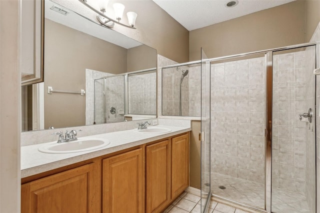 20606 Whitewood Way, Tampa, FL 33647 - bathroom featuring a shower stall, double vanity, and tile patterned flooring