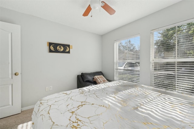bedroom with carpet flooring and a ceiling fan