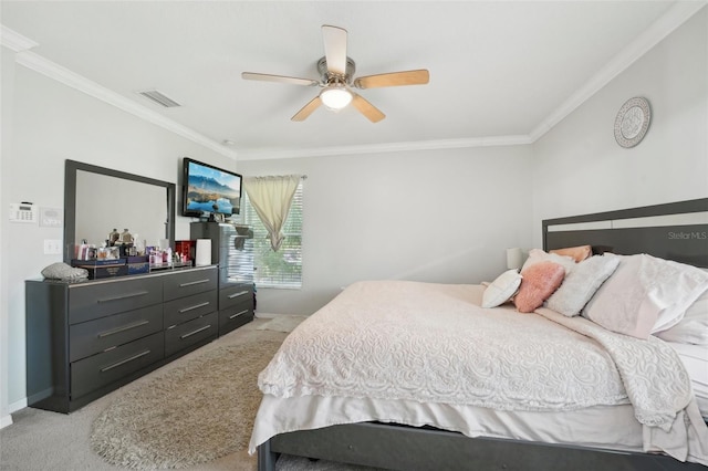 bedroom featuring ornamental molding, light carpet, a ceiling fan, and visible vents