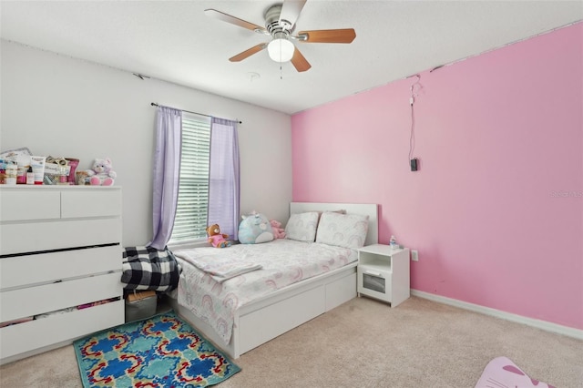 bedroom featuring light colored carpet and ceiling fan