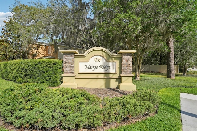 community sign featuring fence