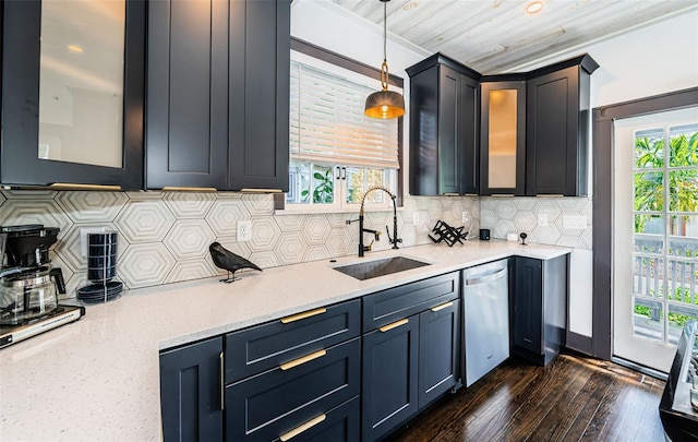 2536 Burlington Ave N, Saint Petersburg, FL 33713 - kitchen with pendant lighting, dark wood-style flooring, dishwasher, a sink, and backsplash