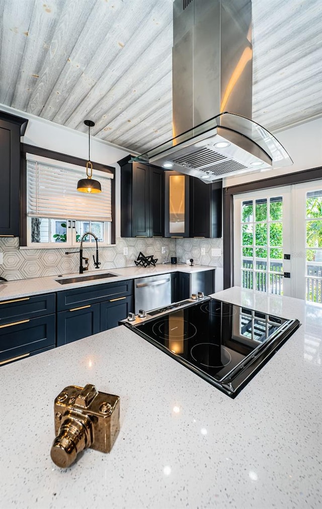 2536 Burlington Ave N, Saint Petersburg, FL 33713 - kitchen featuring light stone counters, tasteful backsplash, island exhaust hood, a sink, and cooktop