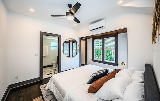 2536 Burlington Ave N, Saint Petersburg, FL 33713 - bedroom featuring a wall unit AC, wood finished floors, recessed lighting, baseboards, and ensuite bath
