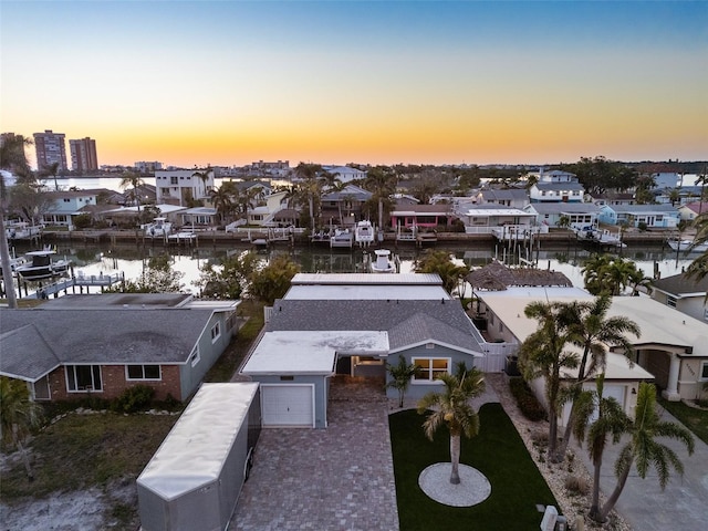 17730 Long Point Dr, Redington Shores, FL 33708 - aerial view at dusk with a residential view and a water view