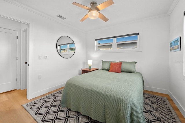 17730 Long Point Dr, Redington Shores, FL 33708 - bedroom with visible vents, light wood-style floors, and ornamental molding