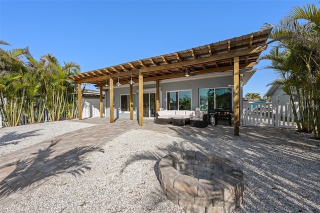17730 Long Point Dr, Redington Shores, FL 33708 - view of patio / terrace featuring fence, an outdoor living space with a fire pit, and a pergola