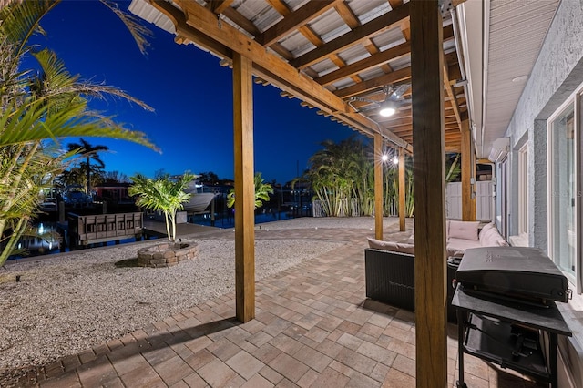 17730 Long Point Dr, Redington Shores, FL 33708 - patio at night featuring fence and area for grilling