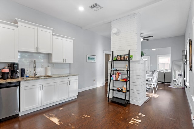 kitchen with decorative backsplash, white cabinets, a sink, visible vents, and dishwasher