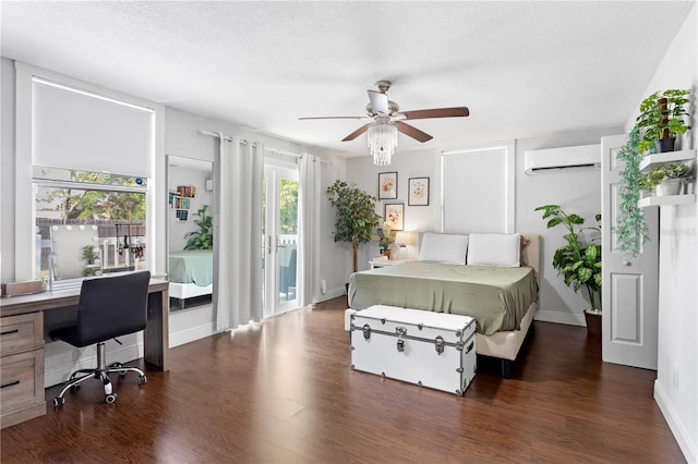 bedroom with a wall mounted AC, access to outside, a ceiling fan, baseboards, and wood finished floors