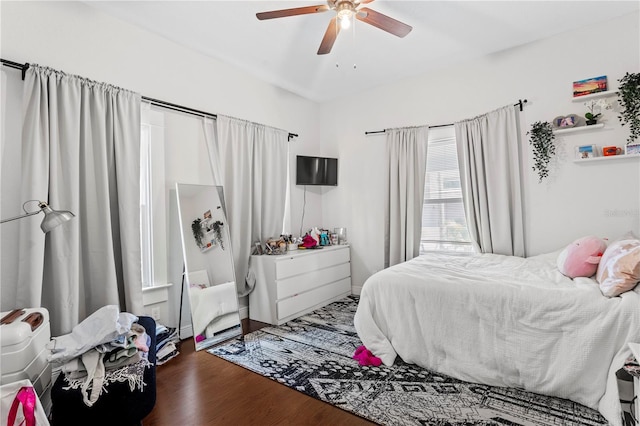 bedroom featuring wood finished floors and a ceiling fan