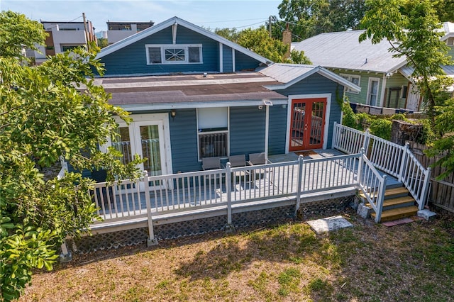 view of front of property with a deck and french doors