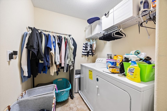 1227 Ballard Green Pl, Brandon, FL 33511 - clothes washing area featuring a textured ceiling, washing machine and clothes dryer, and laundry area